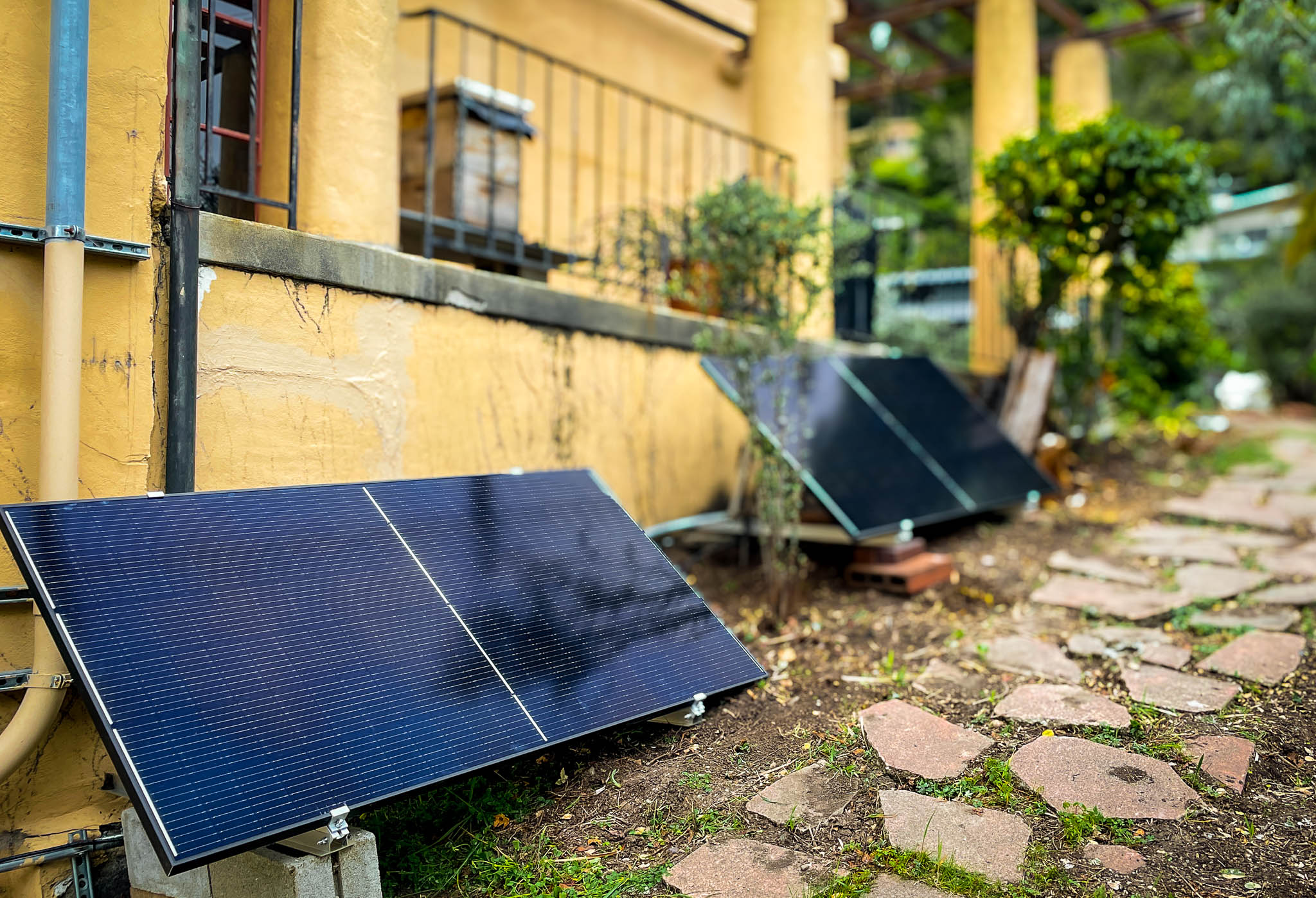 Bright Saver solar panel on lawn — premium product shot